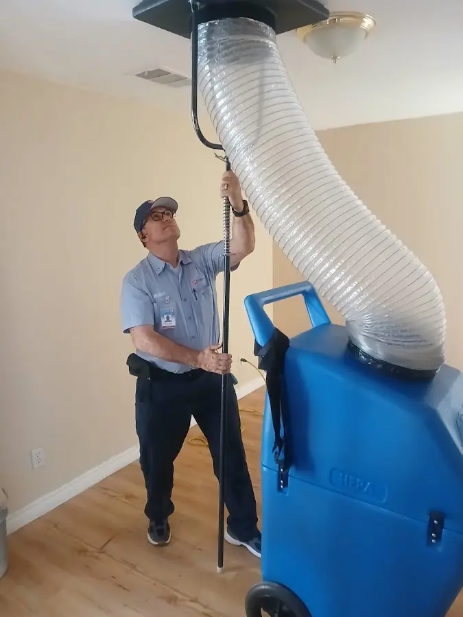 Furnace Tune-Up technician using HEPA equipment in Milwaukie